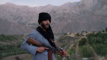 This photo taken on July 8, 2022 shows a Taliban fighter keeping a watch at an outpost in Tawakh Village of Anaba district, Panjshir Province.