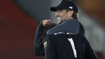 Soccer Football - Premier League - Liverpool v Crystal Palace - Anfield, Liverpool, Britain - June 24, 2020  Liverpool manager Juergen Klopp celebrates with Alisson after the match, as play resumes behind closed doors following the outbreak of the coronav