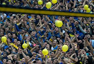 Boca Junior supporters celebrate after their team won Argentina's first division football championship at La Bombonera stadium in Buenos Aires, on June 25, 2017. 