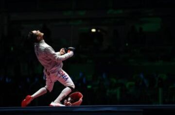 South Korean Kim Jung-Hwan celebrates after defeating Iran's Mojtaba Abedini to claim bronze.