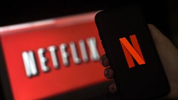 (FILES) In this file photo taken on March 31, 2020 a computer screen and mobile phone display the Netflix logo in Arlington, Virginia. - Netflix on January 20, 2022 reported it ended the year with 221.8 million subscribers, slightly missing its forecast w