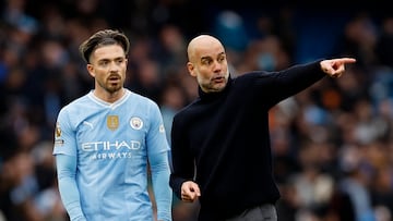 Soccer Football - Premier League - Manchester City v Arsenal - Etihad Stadium, Manchester, Britain - March 31, 2024 Manchester City's Jack Grealish and manager Pep Guardiola after the match Action Images via Reuters/Jason Cairnduff NO USE WITH UNAUTHORIZED AUDIO, VIDEO, DATA, FIXTURE LISTS, CLUB/LEAGUE LOGOS OR 'LIVE' SERVICES. ONLINE IN-MATCH USE LIMITED TO 45 IMAGES, NO VIDEO EMULATION. NO USE IN BETTING, GAMES OR SINGLE CLUB/LEAGUE/PLAYER PUBLICATIONS.