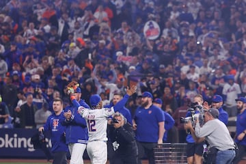 Mets' Francisco Lindor (C) reacts after winning the Major League Baseball (MLB) American League Division Series playoff game 