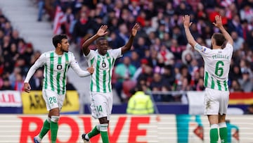 Soccer Football - LaLiga - Atletico Madrid v Real Betis - Metropolitano, Madrid, Spain - March 3, 2024 Real Betis' William Carvalho celebrates scoring their first goal with Chadi Riad and German Pezzella REUTERS/Juan Medina