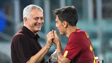 AS Roma's Argentinian forward Paulo Dybala (R) jokes with AS Roma's Portuguese coach Jose Mourinho as he is being substituted during the Italian Serie A football match between AS Roma and Monza on August 30, 2022 at the Olympic stadium in Rome. (Photo by Alberto PIZZOLI / AFP) (Photo by ALBERTO PIZZOLI/AFP via Getty Images)