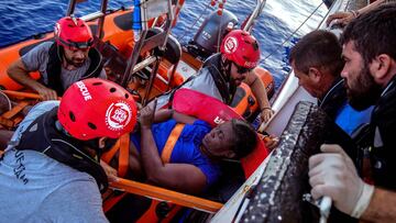 NBA Memphis player Marc Gasol and members of NGO Proactiva Open Arms rescue boat carry an African migrant in central Mediterranean Sea, July 17, 2018. REUTERS/Juan Medina RESCATE MEDITERRANEO 