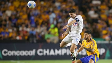 Cruz Azul's Uruguayan midfielder #15 Ignacio Rivero and Tigres' defender #04 Juan Jose Purata during the CONCACAF Champions Cup semifinals first leg football match between Mexico's Tigres and Cruz Azul at the UANL University Stadium in Monterrey, Nuevo Leon State, Mexico, on April 23, 2025. (Photo by Julio Cesar AGUILAR / AFP)