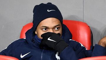 France's forward Kylian Mbappe looks on as he sits on the bench during the Euro 2020 Group H football qualification match between Albania and France at the Air Albania Stadium in Tirana, on November 17, 2019. (Photo by FRANCK FIFE / AFP)
