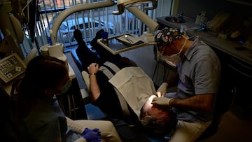 Hungarian dentist Ivan Solymosi checks British patient Bob Martin's implants at the Kreativ Dental Clinic in Budapest, Hungary, February 10, 2023. REUTERS/Marton Monus