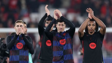 (From L) Barcelona's Spanish midfielder #16 Fermin Lopez, Barcelona's Polish forward #09 Robert Lewandowski and Barcelona's French defender #23 Jules Kounde celebrate at the end of the UEFA Champions League Round of 16 first leg football match between SL Benfica and FC Barcelona at Estadio da Luz stadium in Lisbon on March 5, 2025. Barcelona won 0-1. (Photo by FILIPE AMORIM / AFP)