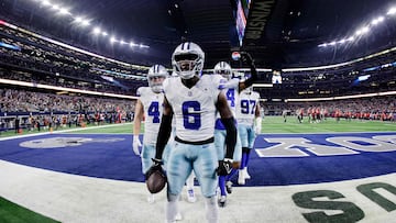 ARLINGTON, TEXAS - DECEMBER 22: Donovan Wilson #6 of the Dallas Cowboys celebrates a stop with teammates during the fourth quarter of a game against the Tampa Bay Buccaneers at AT&T Stadium on December 22, 2024 in Arlington, Texas.   Ron Jenkins/Getty Images/AFP (Photo by Ron Jenkins / GETTY IMAGES NORTH AMERICA / Getty Images via AFP)