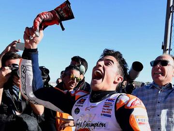 Repsol Honda Team&#039;s Spanish rider Marc Marquez celebrates after the MotoGP race of the Valencia Grand Prix at Ricardo Tormo racetrack in Cheste, near Valencia on November 12, 2017. 
 Spain&#039;s Marc Marquez sealed his sixth world championship and fourth in the premier MotoGP category with third place at the Valencia Grand Prix. Marquez&#039;s Honda teammate Dani Pedrosa won the race from France&#039;s Johann Zarco in second.
  / AFP PHOTO / JOSE JORDAN