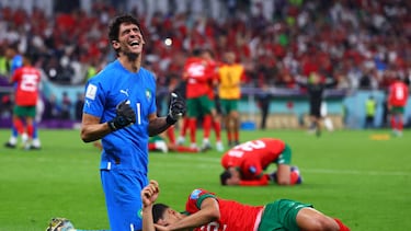 10 December 2022, Qatar, Doha: Soccer, World Cup, Morocco - Portugal, final round, quarterfinal, Al-Thumama Stadium, Morocco's goalkeeper Bono and Morocco's Achraf Hakimi cheer after the victory. Photo: Tom Weller/dpa (Photo by Tom Weller/picture alliance via Getty Images)