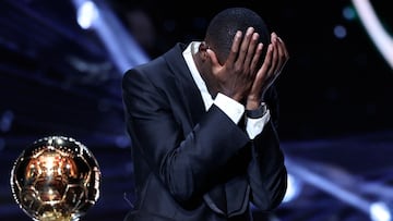 Paris Saint-Germain's French forward Ousmane Dembele reacts after receiving the Ballon d'Or award during the 2025 Ballon d'Or France Football award ceremony at the Theatre du Chatelet in Paris on September 22, 2025. (Photo by Franck FIFE / AFP)
