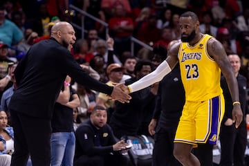 Lakers forward LeBron James reacts with head coach Darvin Ham.