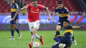 Soccer Football - Copa Libertadores - Round of 16 - First Leg - Internacional v Boca Juniors - Beira Rio Stadium, Porto Alegre, Brazil - December 2, 2020 Boca Juniors' Frank Fabra in action with Internacional's Thiago Galhardo Pool via REUTERS/Diego Vara