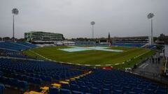 Covers sit over the wicket as rain halts play on the first day of the first cricket Test match between England and Sri Lanka at Headingley in Leeds, northern England on May 19, 2016.