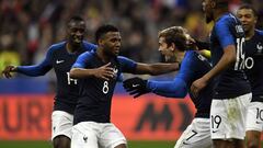 Lemar celebra un gol con Francia junto a Griezmann, del Atl&eacute;tico.