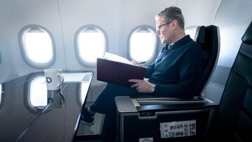 FILE PHOTO: Prime Minister Sir Keir Starmer works on board a Government plane as he travels to Rio de Janeiro, Brazil to attend the G20 summit. Picture date: Sunday November 17, 2024. Stefan Rousseau/Pool via REUTERS/File Photo
