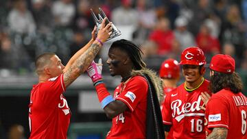 CLEVELAND, OHIO - SEPTEMBER 26: Nick Senzel #15 crowns Elly De La Cruz #44 of the Cincinnati Reds after De La Cruz hit a two-run home run during the ninth inning against the Cleveland Guardians at Progressive Field on September 26, 2023 in Cleveland, Ohio.   Jason Miller/Getty Images/AFP (Photo by Jason Miller / GETTY IMAGES NORTH AMERICA / Getty Images via AFP)