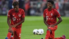 Bayern Munich&#039;s French defender Kingsley Coman (L) and Bayern Munich&#039;s Austrian defender David Alaba (R) warm up prior to the German First division Bundesliga football match FC Bayern Munich v Hertha Berlin in Munich, southern Germany, on August