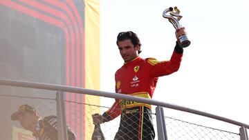 Formula One F1 - Italian Grand Prix - Autodromo Nazionale Monza, Monza, Italy - September 3, 2023 Ferrari's Carlos Sainz Jr. celebrates with a trophy on the podium after finishing third place in the Italian Grand Prix REUTERS/Claudia Greco