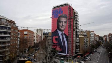 A giant electoral poster of candidate for presidency of FC Barcelona Joan Laporta is displayed on a building next to the Santiago Bernabeu Stadium in Madrid on December 16, 2020. - Barcelona will hold elections for a new president on January 24, following