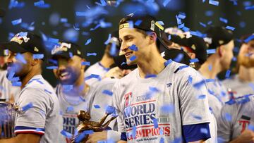 Nov 1, 2023; Phoenix, Arizona, USA; Texas Rangers shortstop Corey Seager (5) holds up the MVP trophy after  winning the 2023 World Series in five games against the Arizona Diamondbacks at Chase Field. Mandatory Credit: Mark J. Rebilas-USA TODAY Sports     TPX IMAGES OF THE DAY
