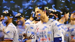 Nov 1, 2023; Phoenix, Arizona, USA; Texas Rangers shortstop Corey Seager (5) holds up the MVP trophy after  winning the 2023 World Series in five games against the Arizona Diamondbacks at Chase Field. Mandatory Credit: Mark J. Rebilas-USA TODAY Sports     TPX IMAGES OF THE DAY