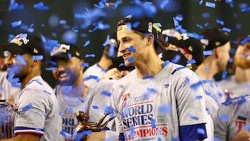 Nov 1, 2023; Phoenix, Arizona, USA; Texas Rangers shortstop Corey Seager (5) holds up the MVP trophy after  winning the 2023 World Series in five games against the Arizona Diamondbacks at Chase Field. Mandatory Credit: Mark J. Rebilas-USA TODAY Sports     TPX IMAGES OF THE DAY