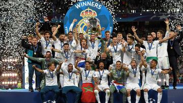 Real Madrid's Spanish defender Sergio Ramos (C) holds the trophy after winning the UEFA Champions League final football match between Liverpool and Real Madrid at the Olympic Stadium in Kiev, Ukraine on May 26, 2018.
Real Madrid defeated Liverpool 3