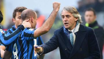 Roberto Mancini gives instructions to forward Rodrigo Palacio during the match between Inter Milan and Carpi FC.