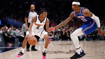 Feb 8, 2022; Denver, Colorado, USA; Denver Nuggets guard Bones Hyland (3) controls the ball as New York Knicks forward Cam Reddish (21) guards in the second quarter at Ball Arena. Mandatory Credit: Isaiah J. Downing-USA TODAY Sports