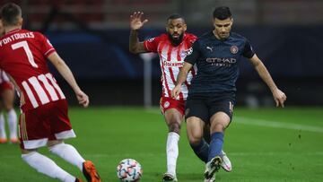 Soccer Football - Champions League - Group C - Olympiacos v Manchester City - Karaiskakis Stadium, Piraeus, Greece - November 25, 2020 Manchester City's Rodrigo in action with Olympiacos' Yann M'Vila REUTERS/Alkis Konstantinidis