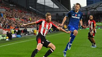Brentford's Norwegian defender #20 Kristoffer Ajer crosses the ball during the English Premier League football match between Brentford and West Ham United at Gtech Community Stadium in London on November 4, 2023. (Photo by Glyn KIRK / AFP) / RESTRICTED TO EDITORIAL USE. No use with unauthorized audio, video, data, fixture lists, club/league logos or 'live' services. Online in-match use limited to 120 images. An additional 40 images may be used in extra time. No video emulation. Social media in-match use limited to 120 images. An additional 40 images may be used in extra time. No use in betting publications, games or single club/league/player publications. /