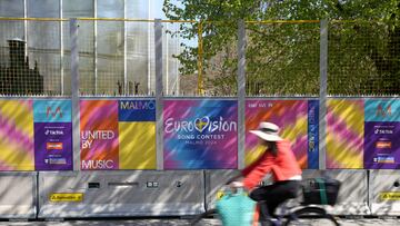 A cyclist passes the signs of the Eurovision Song Contest in Malmo, Sweden, May 1, 2024. REUTERS/Tom Little