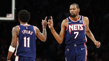 NEW YORK, NEW YORK - APRIL 10: Kevin Durant #7 reacts with Kyrie Irving #11 of the Brooklyn Nets during the second half against the Indiana Pacers at Barclays Center on April 10, 2022 in the Brooklyn borough of New York City. The Nets won 134-126. NOTE TO USER: User expressly acknowledges and agrees that, by downloading and or using this photograph, User is consenting to the terms and conditions of the Getty Images License Agreement.   Sarah Stier/Getty Images/AFP
 == FOR NEWSPAPERS, INTERNET, TELCOS &amp; TELEVISION USE ONLY ==