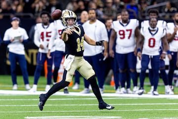 New Orleans Saints quarterback Jake Haener (14) passes 