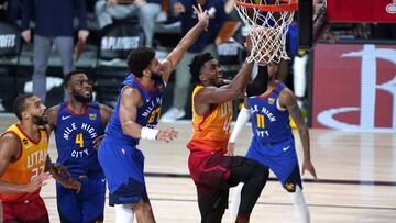 Aug 23, 2020; Lake Buena Vista, Florida, USA; Utah Jazz&#039;s Donovan Mitchell (45) goes up for a shot as Denver Nuggets&#039; Jamal Murray (27) defends during the second half in game four of the first round of the 2020 NBA Playoffs at AdventHealth Arena. Mandatory Credit: Ashley Landis/Pool Photo-USA TODAY Sports