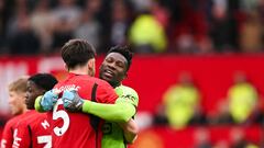 Manchester United's Cameroonian goalkeeper #24 Andre Onana (R) hugs Manchester United's English defender #05 Harry Maguire (L) prior to the start of the English Premier League football match between Manchester United and Burnley at Old Trafford in Manchester, north west England, on April 27, 2024. (Photo by Oli SCARFF / AFP) / RESTRICTED TO EDITORIAL USE. No use with unauthorized audio, video, data, fixture lists, club/league logos or 'live' services. Online in-match use limited to 120 images. An additional 40 images may be used in extra time. No video emulation. Social media in-match use limited to 120 images. An additional 40 images may be used in extra time. No use in betting publications, games or single club/league/player publications. / 