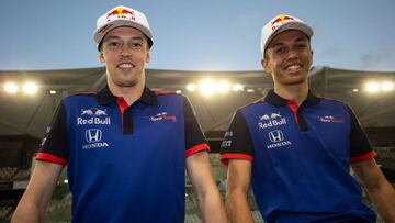 ABU DHABI, UNITED ARAB EMIRATES - NOVEMBER 27:  Alexander Albon of Thailand and Scuderia Toro Rosso and Daniil Kvyat of Russia and Scuderia Toro Rosso pose for a photo during day one of F1 End of Season Testing at Yas Marina Circuit on November 27, 2018 i