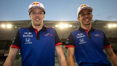 ABU DHABI, UNITED ARAB EMIRATES - NOVEMBER 27:  Alexander Albon of Thailand and Scuderia Toro Rosso and Daniil Kvyat of Russia and Scuderia Toro Rosso pose for a photo during day one of F1 End of Season Testing at Yas Marina Circuit on November 27, 2018 i