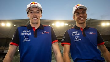 ABU DHABI, UNITED ARAB EMIRATES - NOVEMBER 27: Alexander Albon of Thailand and Scuderia Toro Rosso and Daniil Kvyat of Russia and Scuderia Toro Rosso pose for a photo during day one of F1 End of Season Testing at Yas Marina Circuit on November 27, 2018 i