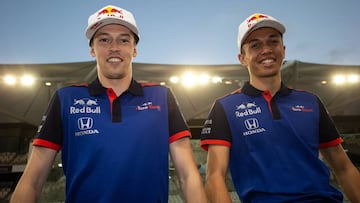 ABU DHABI, UNITED ARAB EMIRATES - NOVEMBER 27:  Alexander Albon of Thailand and Scuderia Toro Rosso and Daniil Kvyat of Russia and Scuderia Toro Rosso pose for a photo during day one of F1 End of Season Testing at Yas Marina Circuit on November 27, 2018 i