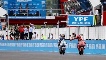 MotoGP - Argentina Grand Prix - Autodromo Termas de Rio Hondo, Santiago del Estero, Argentina - March 16, 2025 Ducati Lenovo Team's Marc Marquez celebrates winning the race with second place BK8 Gresini Racing MotoGP's Alex Marquez REUTERS/Agustin Marcarian