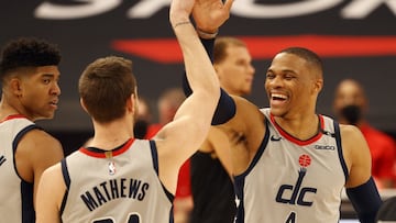 May 6, 2021; Tampa, Florida, USA; Washington Wizards guard Garrison Mathews (24) is congratulated by Washington Wizards guard Russell Westbrook (4) as he makes a 3 point basket in the act of getting fouled and shoots and one during the second half against the Toronto Raptors at Amalie Arena. Mandatory Credit: Kim Klement-USA TODAY Sports