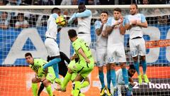 Angers&#039; French defender Thomas Mangani (C) shoots the ball during the French L1 football match Olympique de Marseille (OM) vs Angers at the Velodrome stadium in Marseille, on 30 March, 2019. (Photo by Christophe SIMON / AFP)