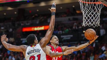 ELX67. MIAMI (EE.UU.), 23/03/2017.- El jugador de Miami Heat Hassan Whiteside (i) en acci&oacute;n ante DeMar DeRozan (d), de Toronto Raptors, durante su partido de baloncesto de la NBA hoy, jueves 23 de marzo de 2017, en el American Airlines Arena de Miami (EE.UU.). EFE/ERIK S. LESSER