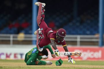 West Indies' Chadwick Walton collides with Pakistan's Ahmed Shehzad during the second T20 match in Port of Spain, Trinidad.