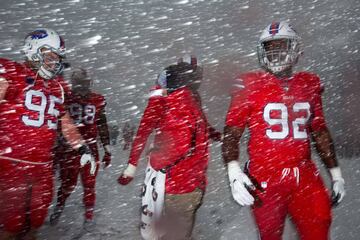 ORCHARD PARK, NY - DECEMBER 10: Kyle Williams #95, Deandre Coleman #98 and Adolphus Washington #92 of the Buffalo Bills warm up before a game against the Indianapolis Colts on December 10, 2017 at New Era Field in Orchard Park, New York. Bryan Bennett/Get